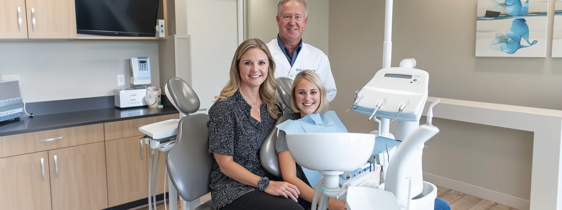 a happy family of three, with bright smiles, receiving personalized dental care in a modern and welcoming environment at waters davidson dental care in olathe.