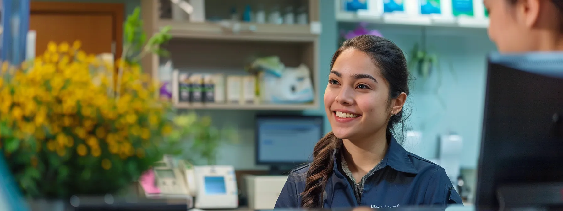 a welcoming dental office reception area with a friendly receptionist eagerly assisting a patient in scheduling an appointment with waters davidson.